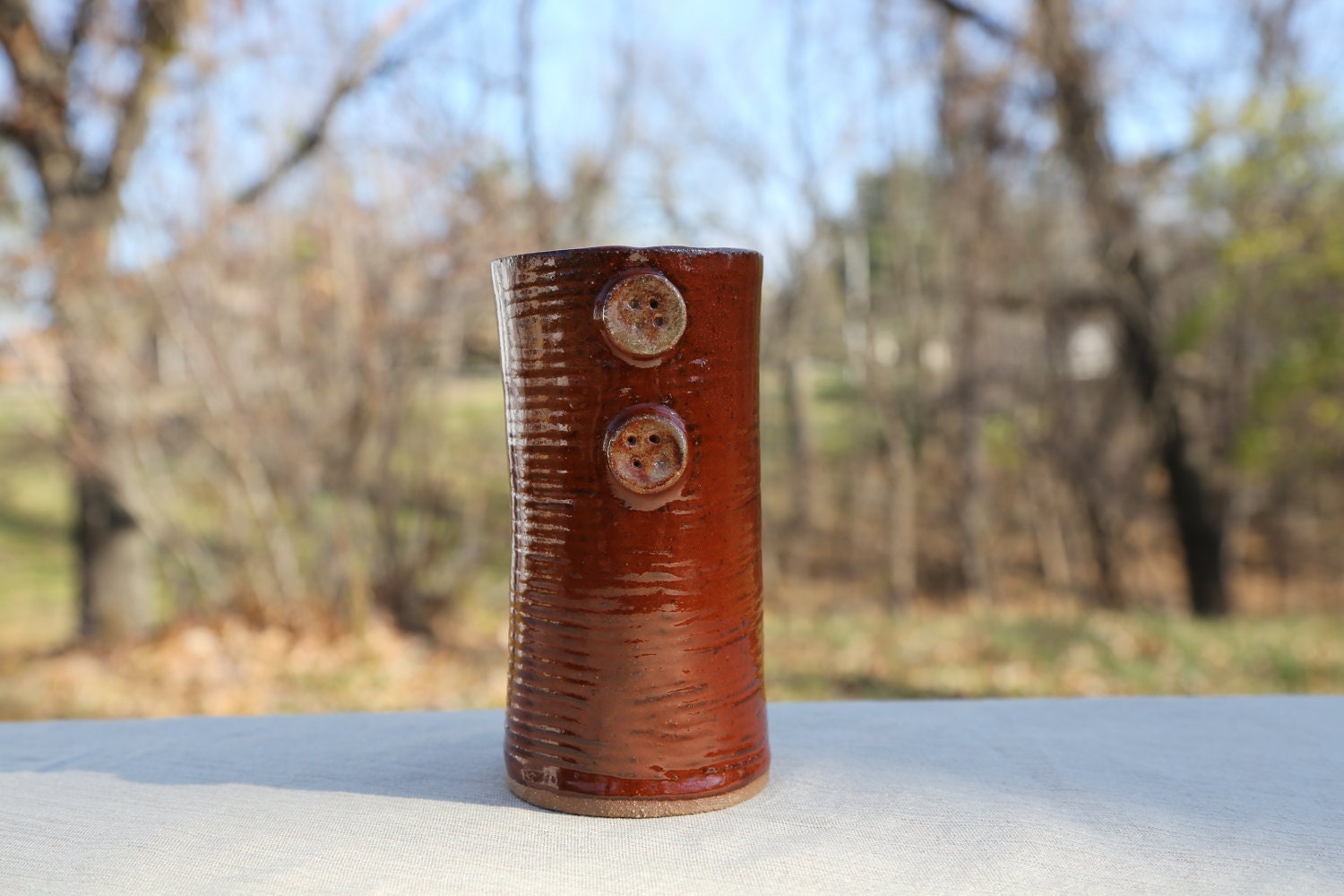 Tall button tumbler
