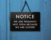 Funny Shop Sign. We are presently not open because we are closed