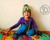 Boy's Pom pom hat with earflaps Neon yellowgreen color elements.