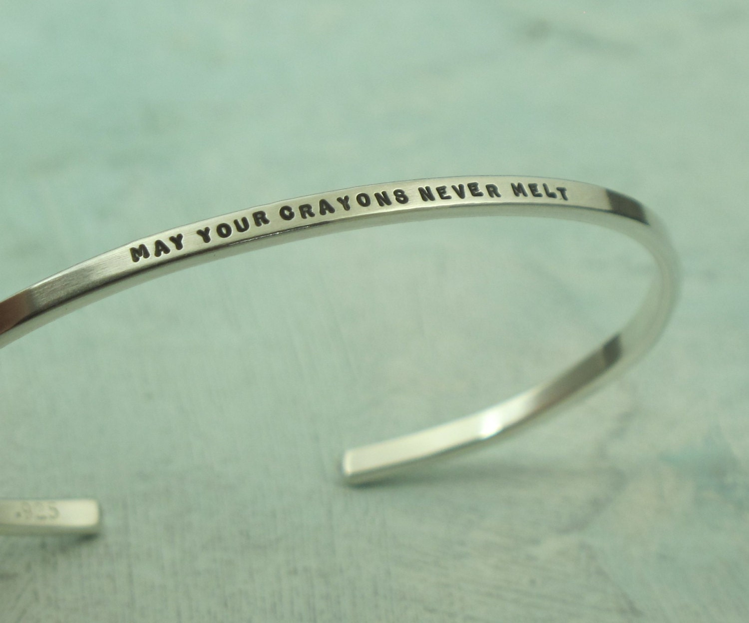 Silver Cuff Bracelet - May Your Crayons Never Melt - by Kathryn Riechert (tiny text)