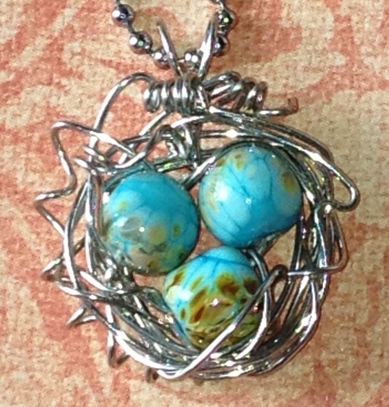Lampwork bead wirewrapped bird nest pendant necklace