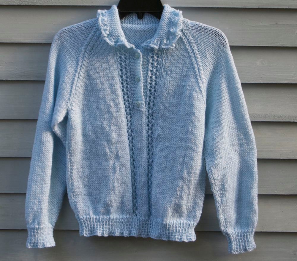 Girl, size 12/14, Pale Blue Sweater with ruffled collar.