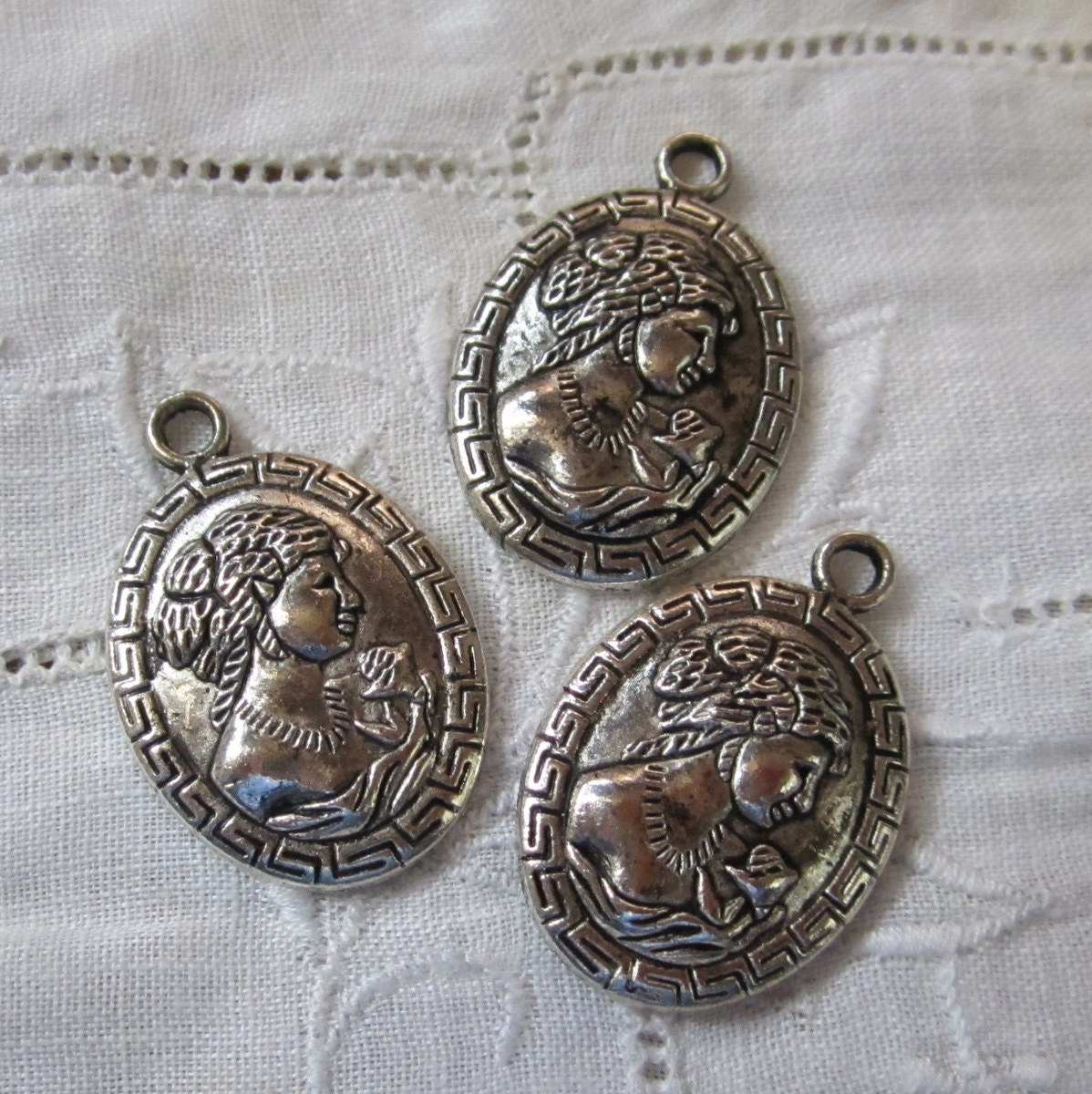 Lot of Three Pressed Metal Cameo Charms