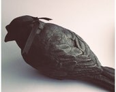 Blindsided, Plaster bird sculpture by Darla Jackson