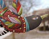 Red Bird with Multicolor Feathers