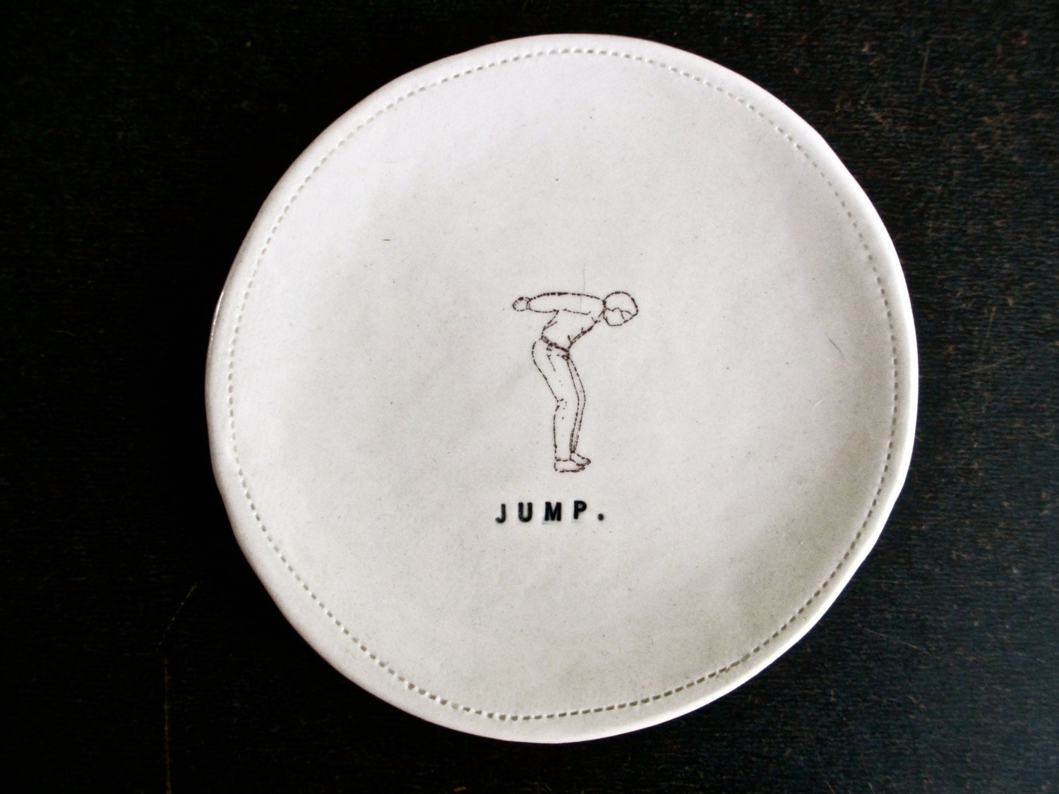 4.5" porcelain dish (JUMP.).
