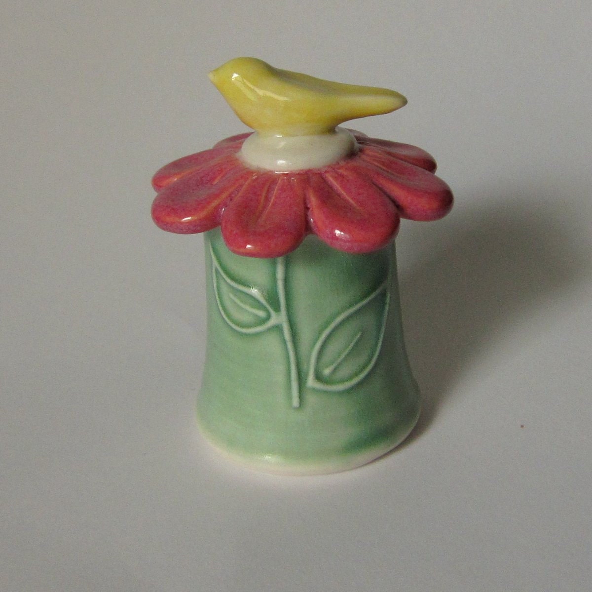 Spring  Bird Jar in Porcelain Gerber Daisy Lid and  Green Stem Base