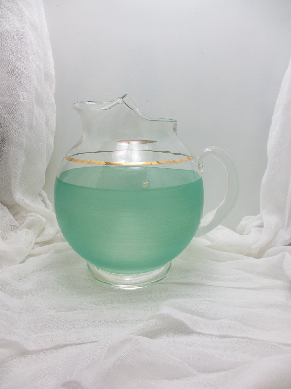Vintage round glass pitcher in mint and gold leaf
