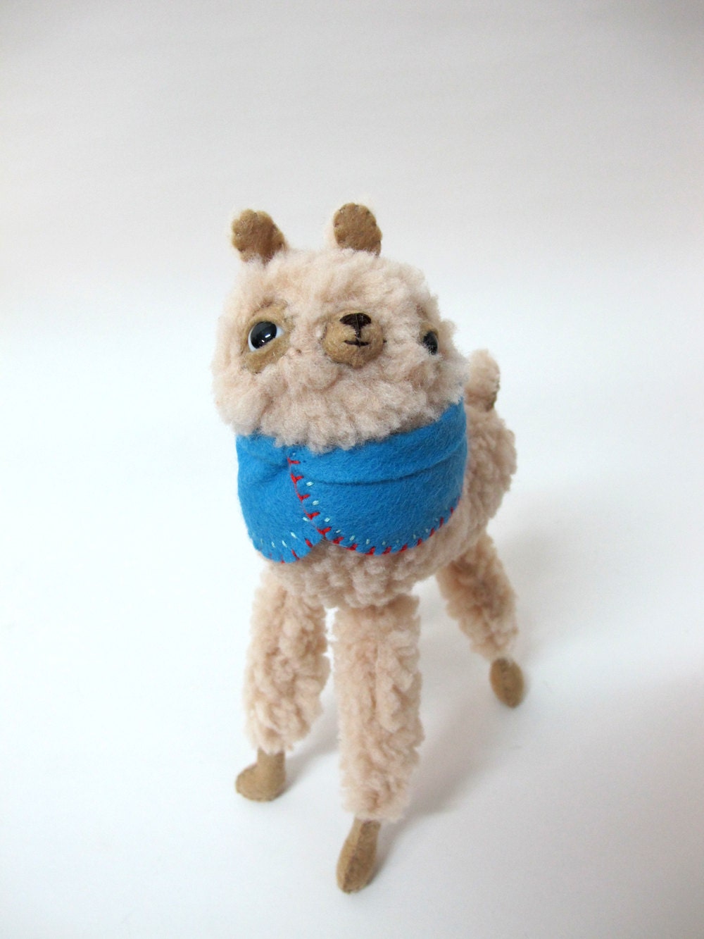 Small Wooly Alpaca in a Blue Embroidered Cape