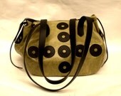 Large green chubby bag with black retro design detail