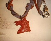 Goldstone horse pendant on ribbon necklace