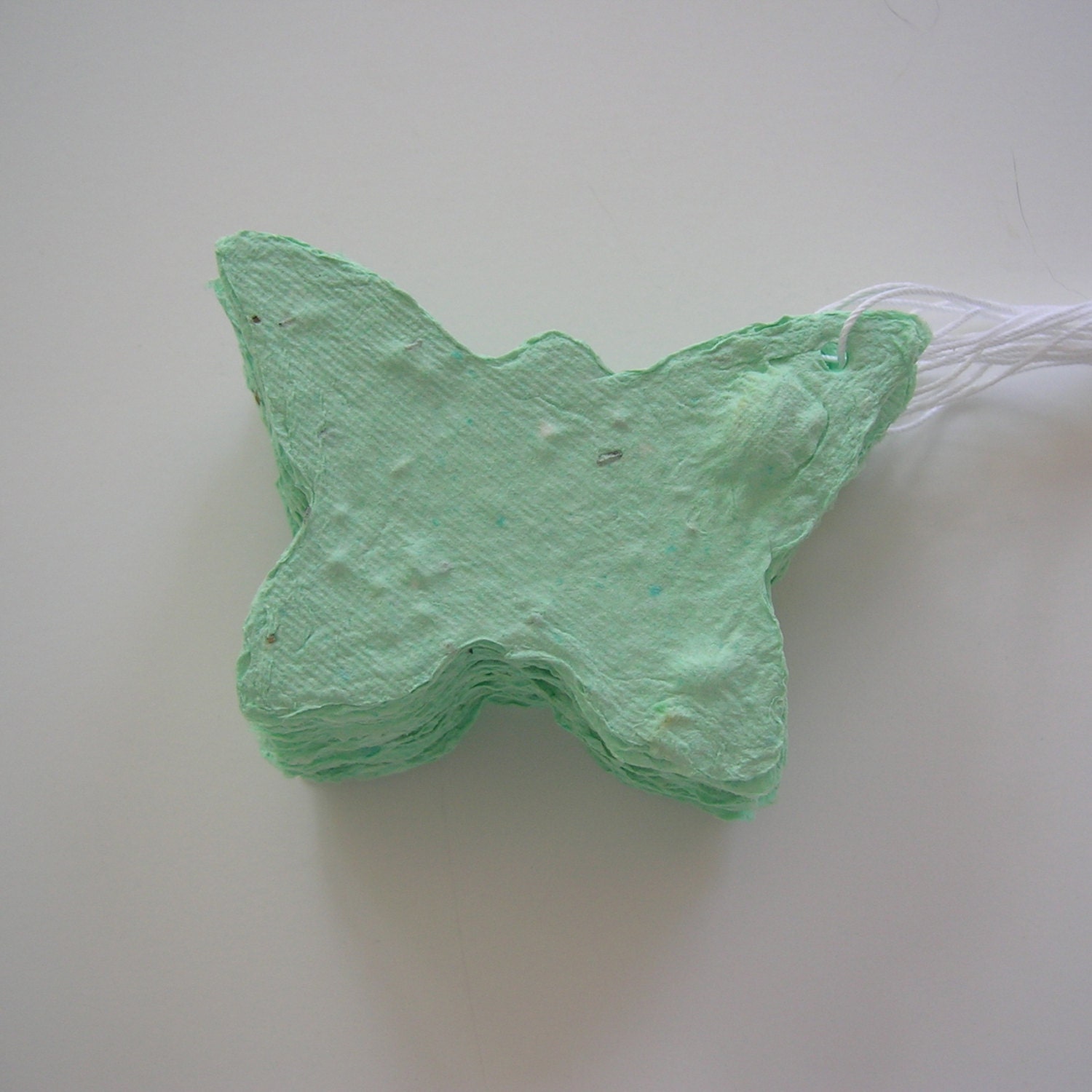 Plantable paper butterflies in celadon green - Made of handmade paper & flower seeds - Wedding place card, wedding favor