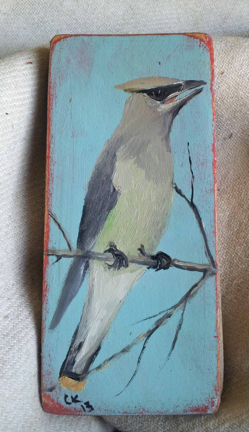 Cedar waxwing on maple