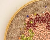 Beaded hand embroidery wall art, geometric triangles green, peach and burgundy on rustic fabric