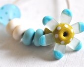 p i n o c e a n handmade lampwork beads set (8) - flower / blue and mustard-