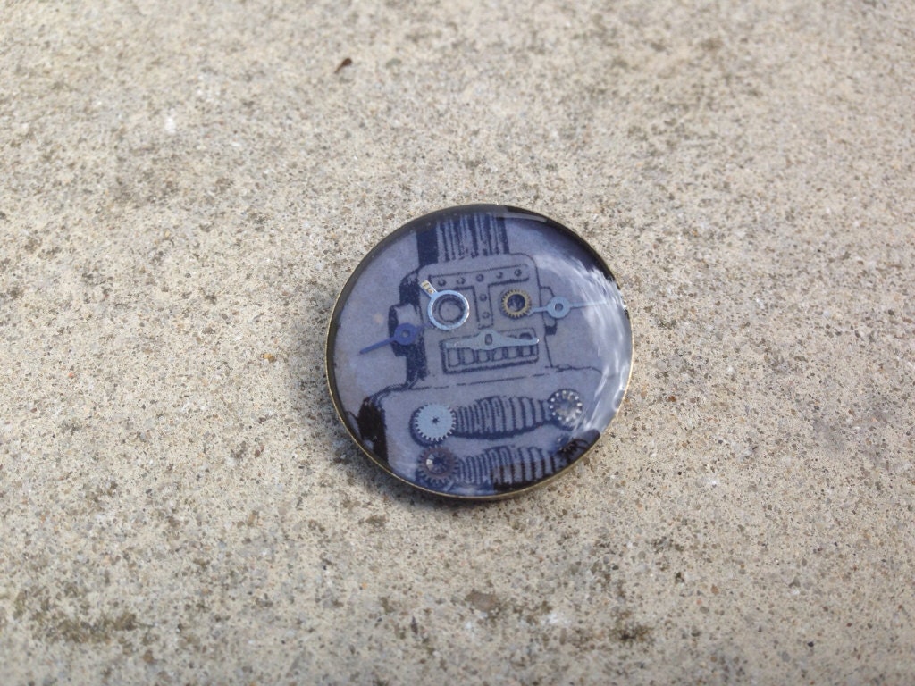 Black robot with cogs badge