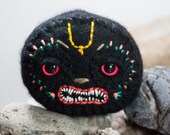 small and handsome Nrsimhadeva Sila in recycled black cashmere
