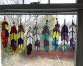 another flock  Indian Chief  Eagle Feather  stained glass with Beads in purples blues etc