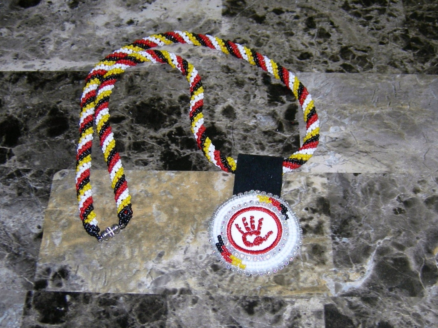 Red hand necklace
