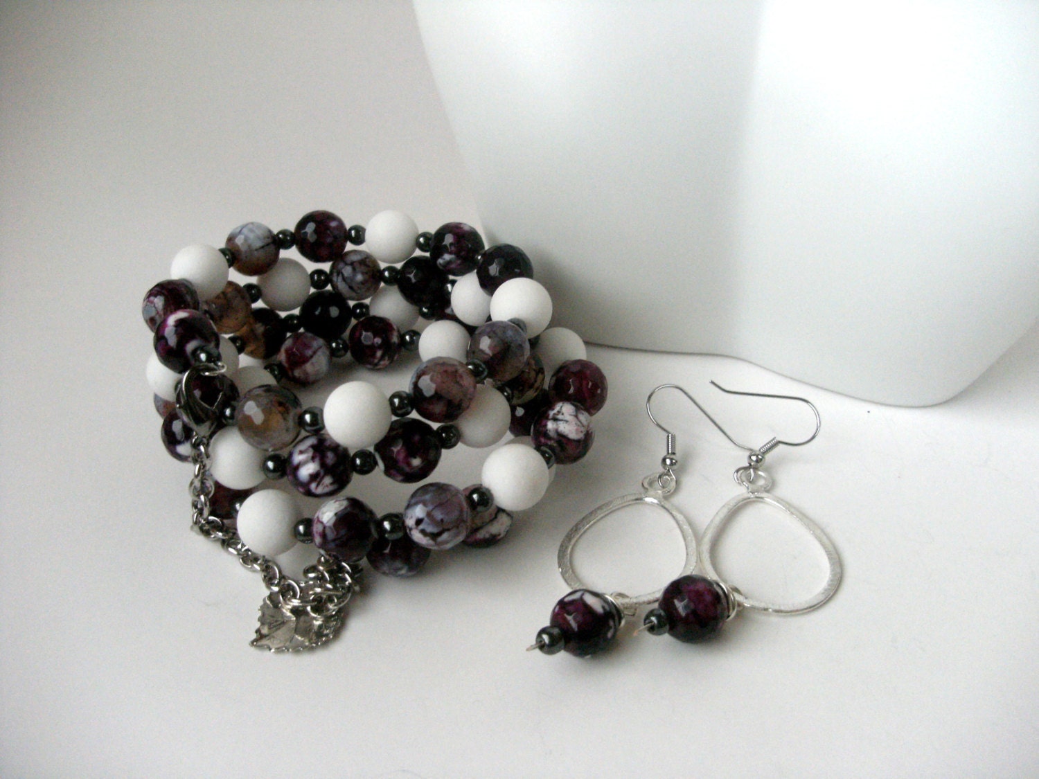 Gemstone wrap bracelet with chain and leaf charm and matching earrings