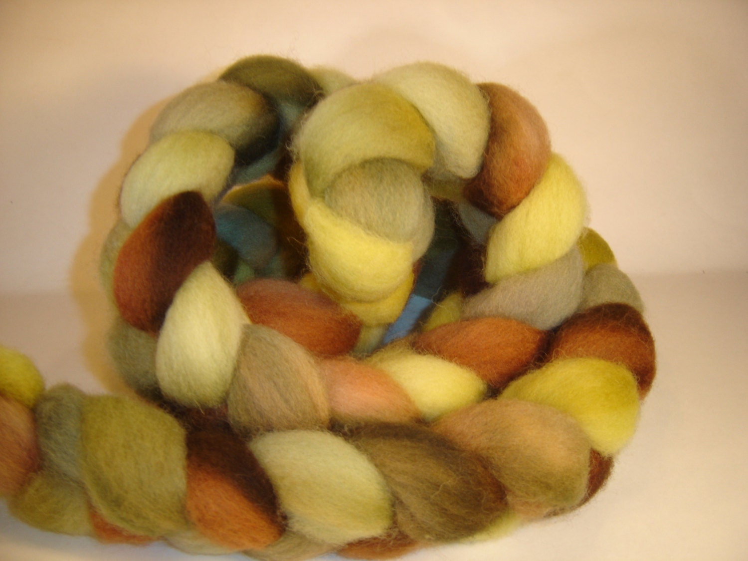 Combed Top, Roving, Spinning,  fiber,  Shetland Hand dyed in  Swamp Monster 4 oz braid  Olive Green, yellow, Brown , tan