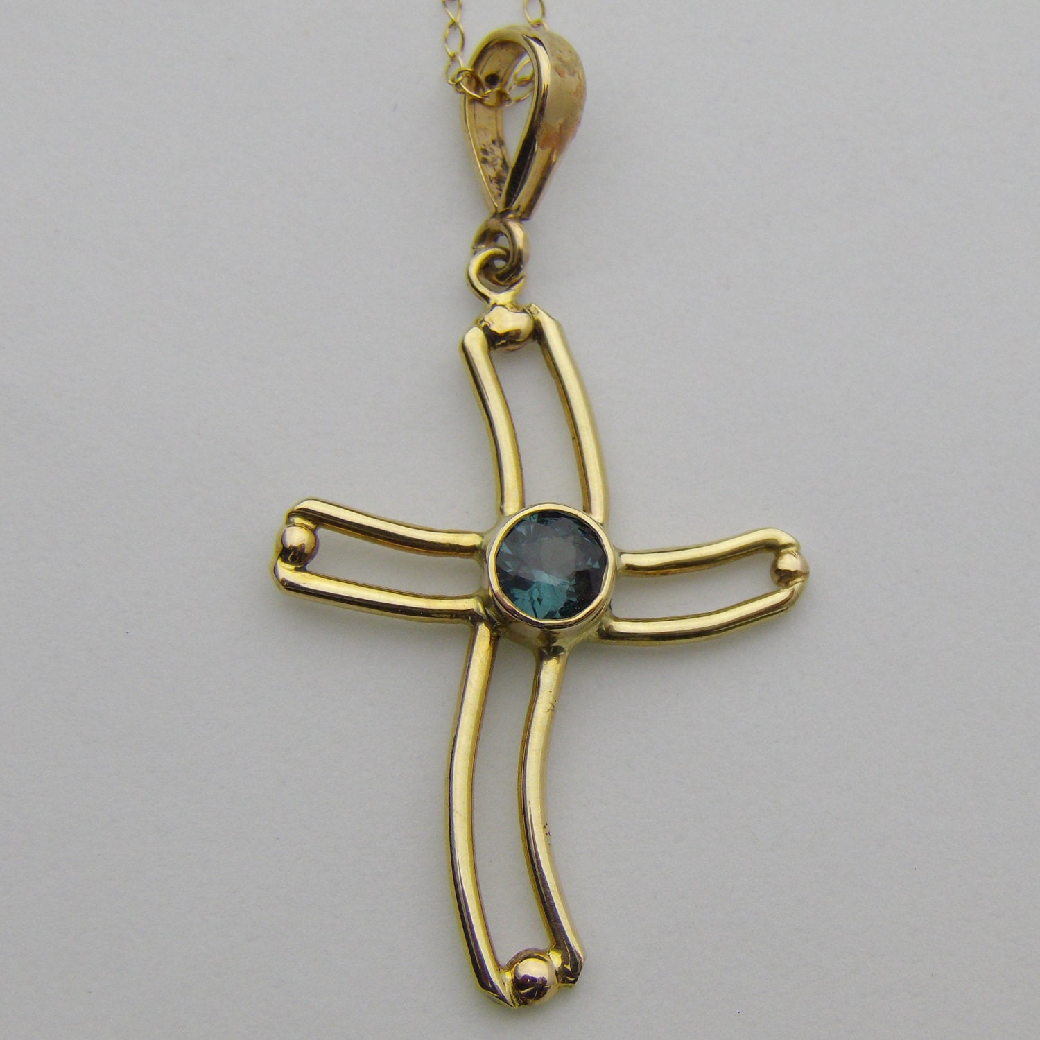 Gold Cross with Color Change Garnet Necklace