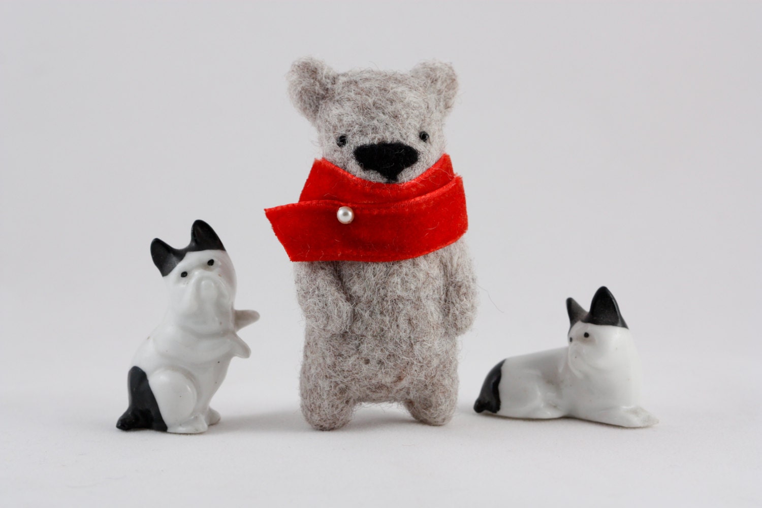Felted off white bear brooch with red scarf