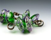 Handmade glass bead pair / Tapered discs / Grass green with enamel and purple accents