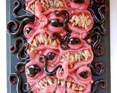 Nightmare Sushi relief sculpture