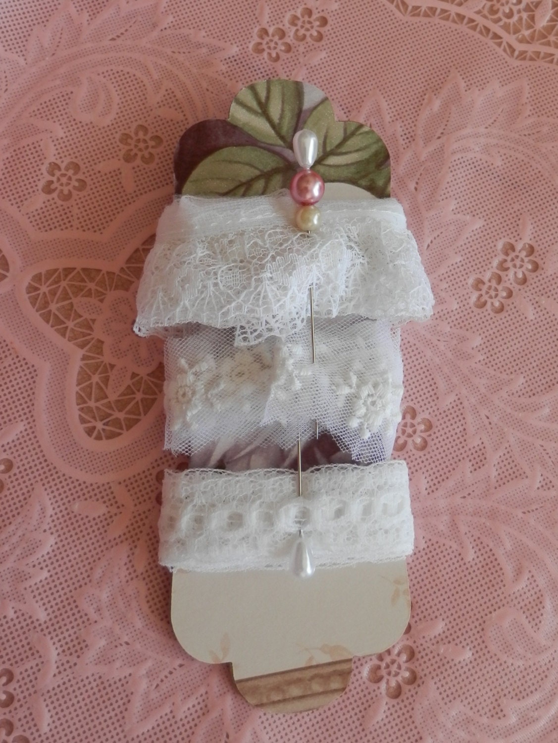 Inspiration tag with vintage trims and fancy straight pins