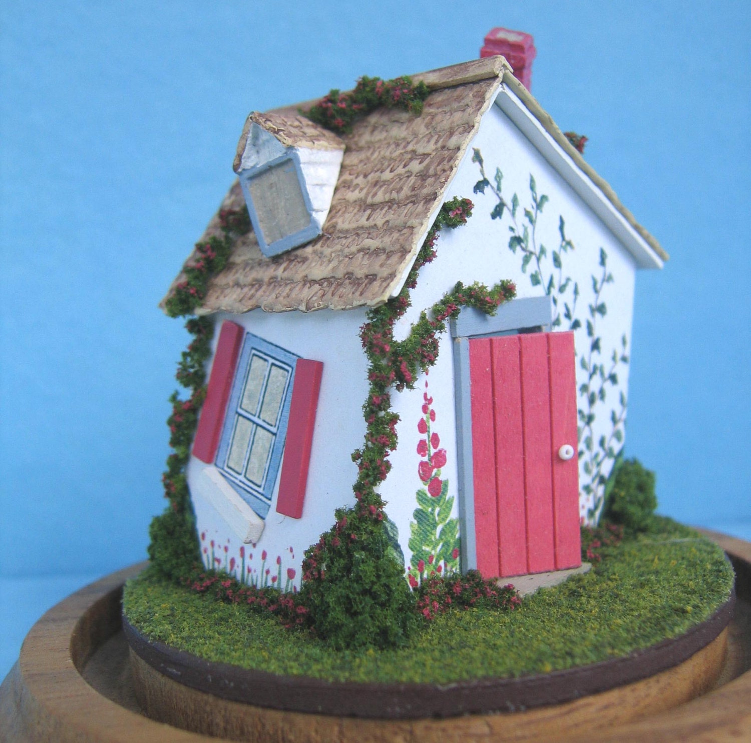 Two miniature Nursery Rhyme playhouse laser cut kits in quarter scale.