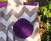 The Scott.... Gray chevron with purple/plum lining and rosette On the GO Diaper Bag