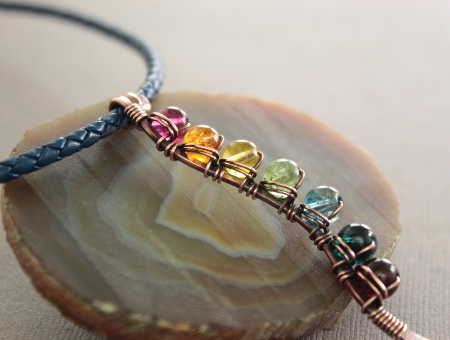 Rainbow vine copper necklace with round rainbow colors quartz stones on navy blue braided leather