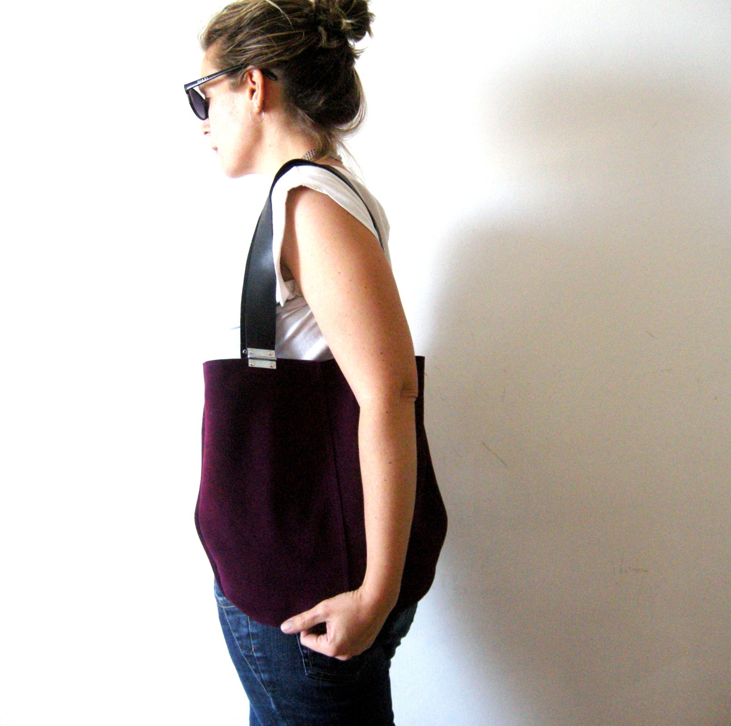 Suede purple leather bag with black strips and hinges