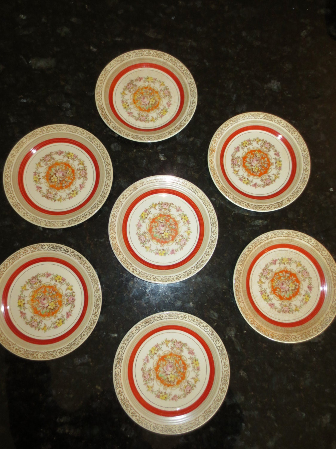 Triumph American limoges Sebring Ohio warranted 22 k gold 6 inch dessert plates. Set of 7