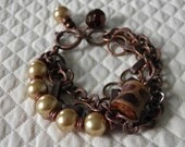 Chain bracelet with glass pearls and unique charms