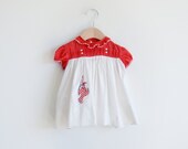 Vintage red and white baby's girl's dress with clown patch.