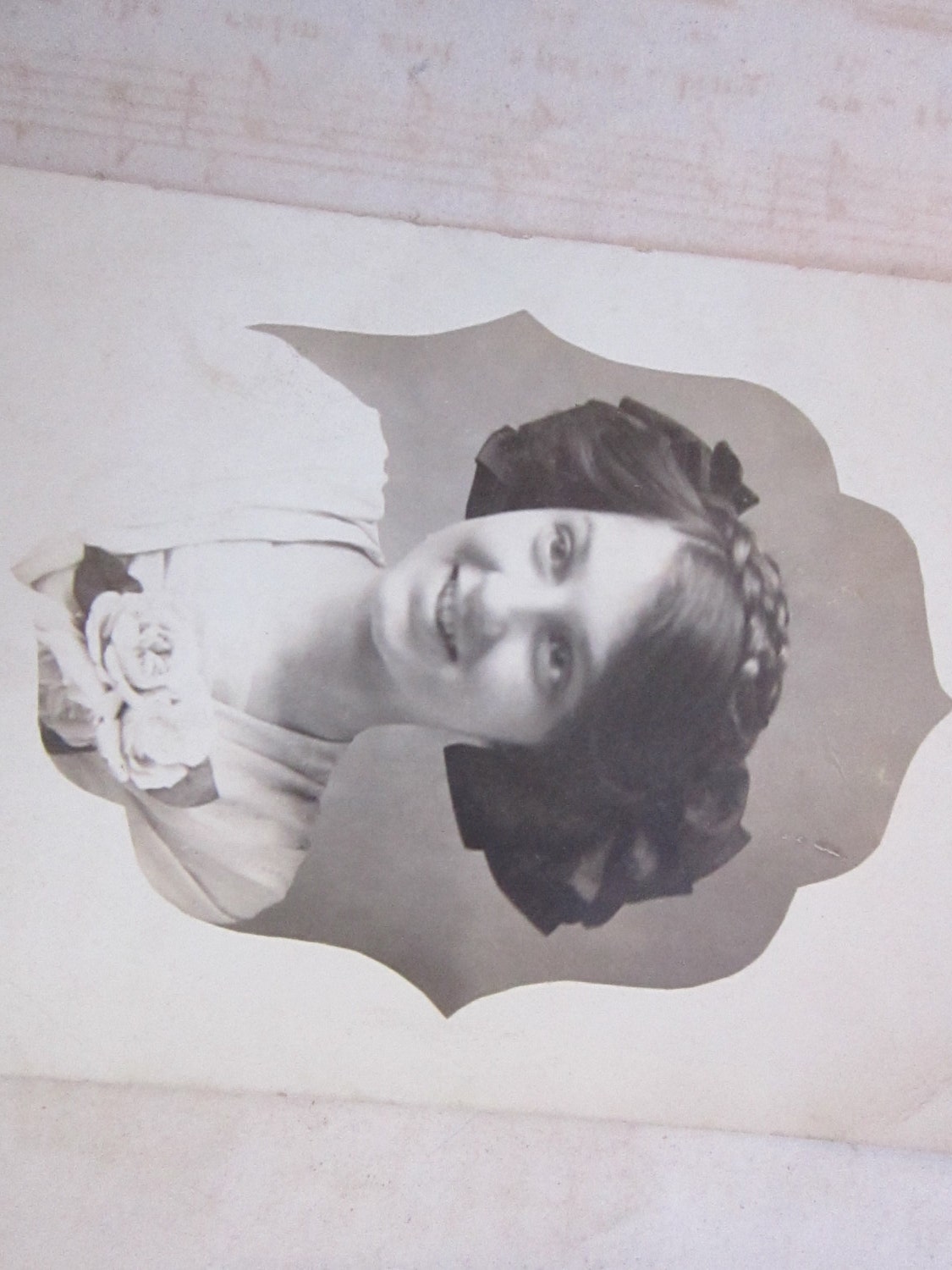 antique postcard - RPPC - pretty GIRL with braids, bows, and corsage - real photographic postcard