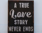 A True Love Story Never Ends - 12" x 16" typography sign.