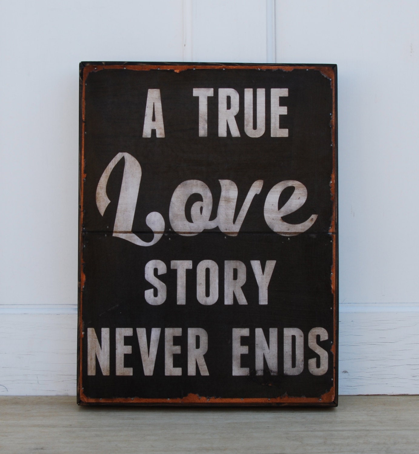 A True Love Story Never Ends - 12" x 16" typography sign.
