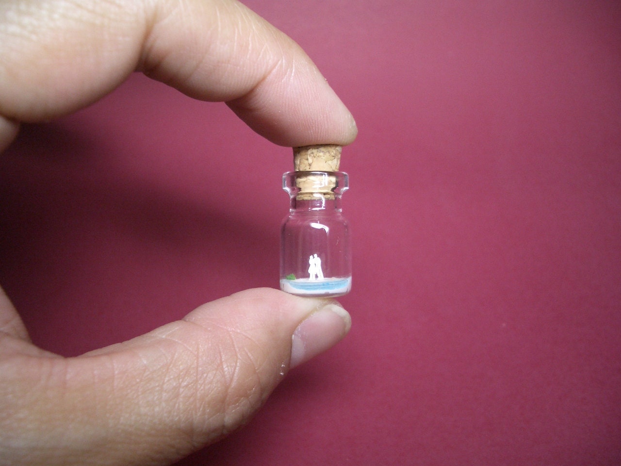 A couple at the beach in a tiny bottle
