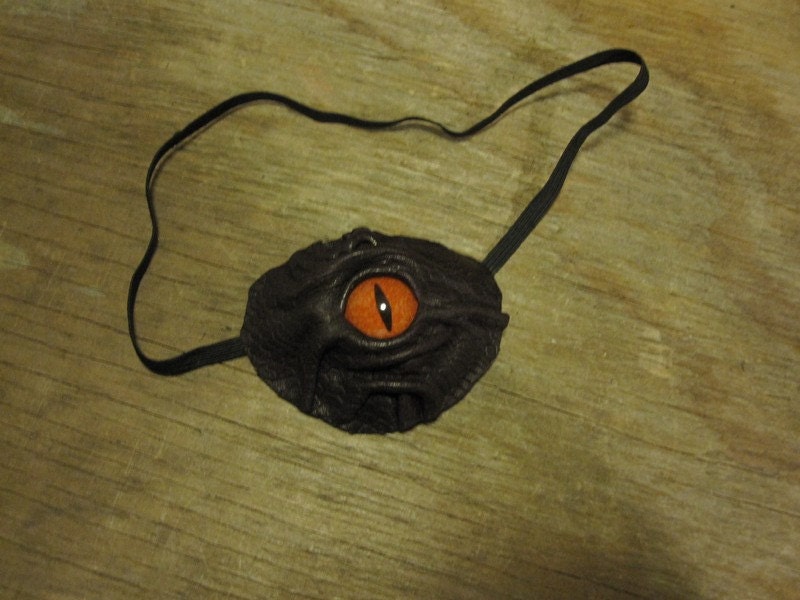 Grichels leather eyepatch - scaly plum purple with poppy orange speckled slit pupil reptile eye