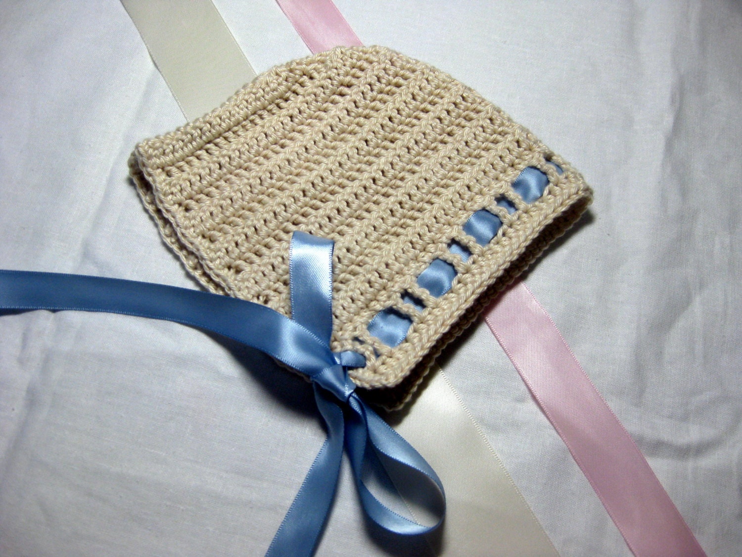 Satin trimmed crochet baby bonnet