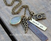 The antique vintage vibe in rectangles. Capture Life. Snap On. with beautiful large green crystal drop and angel wing