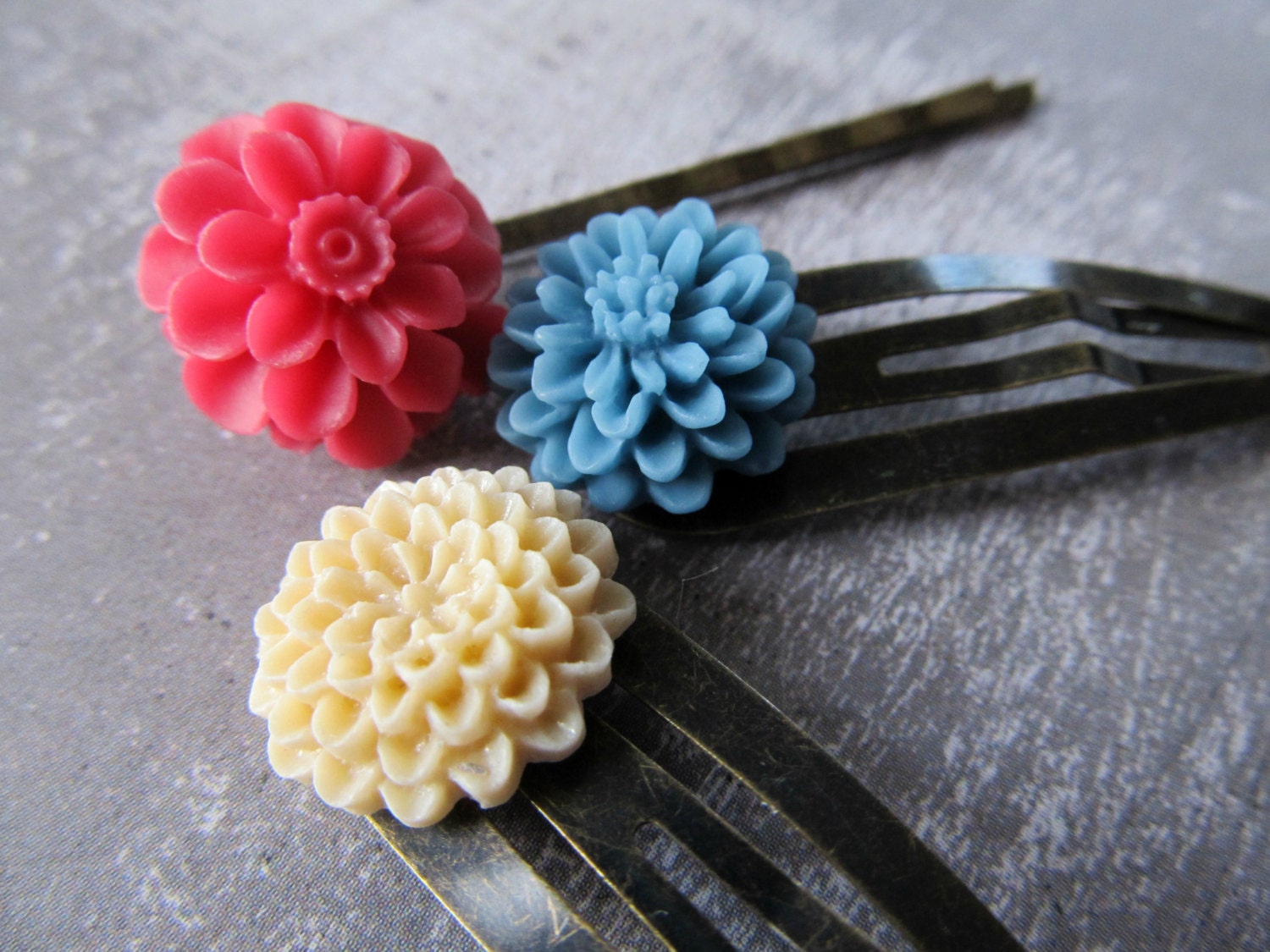 A set of three flower hair pins- rapsberry, slate blue and beige