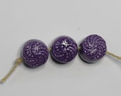 Trio of handmade ceramic button beads in purple