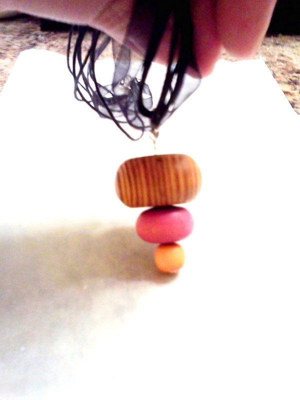 Topsy turvy wooden bead pendant