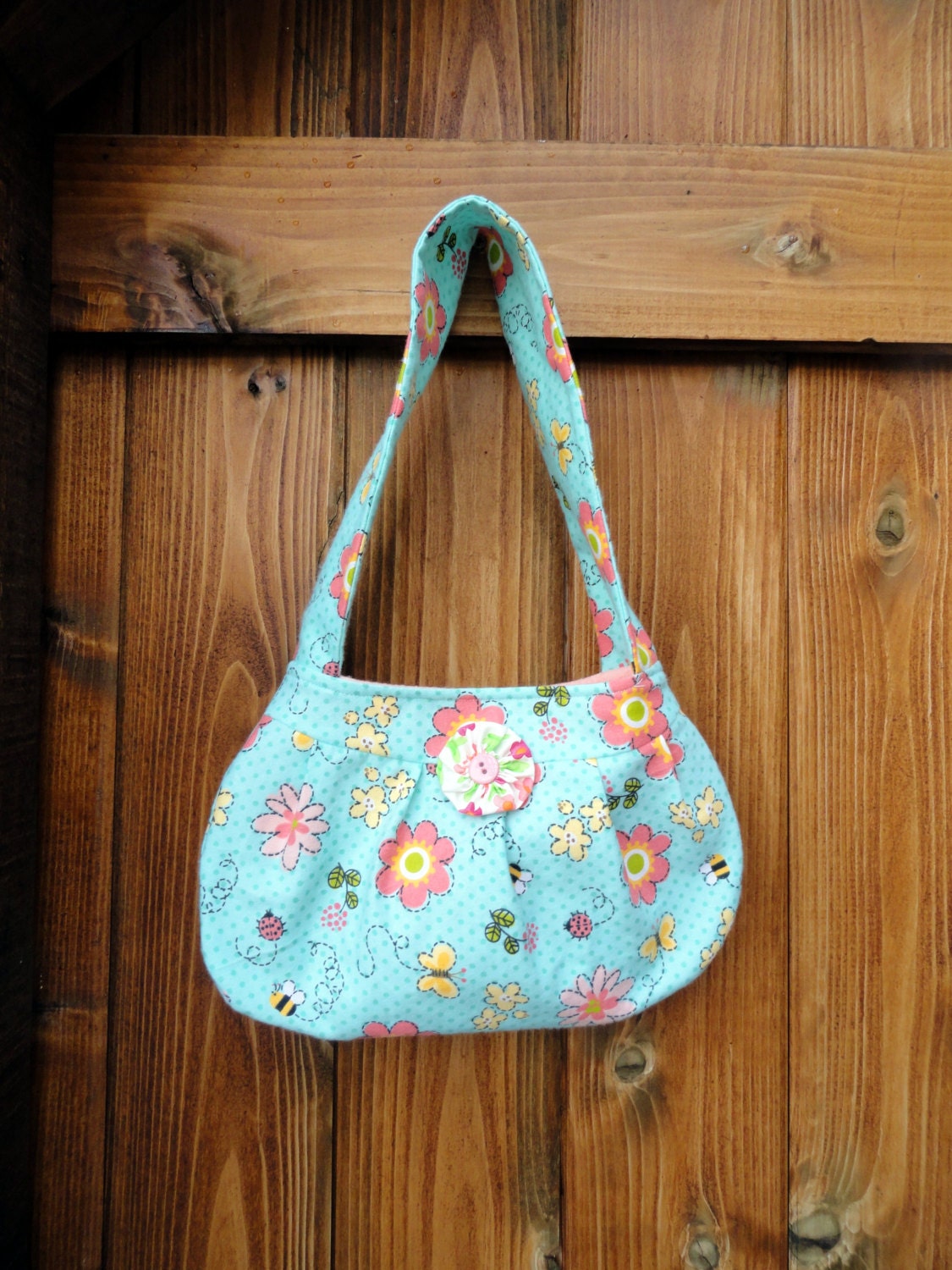 Floral print purse with button detail