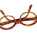 oval cat eye glasses. tortoise shell plastic circular eyeglasses. new old stock/NOS/deadstock. Fiesta size 48-20.