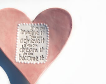 Pink heart tea dish with white dotted detail and quote